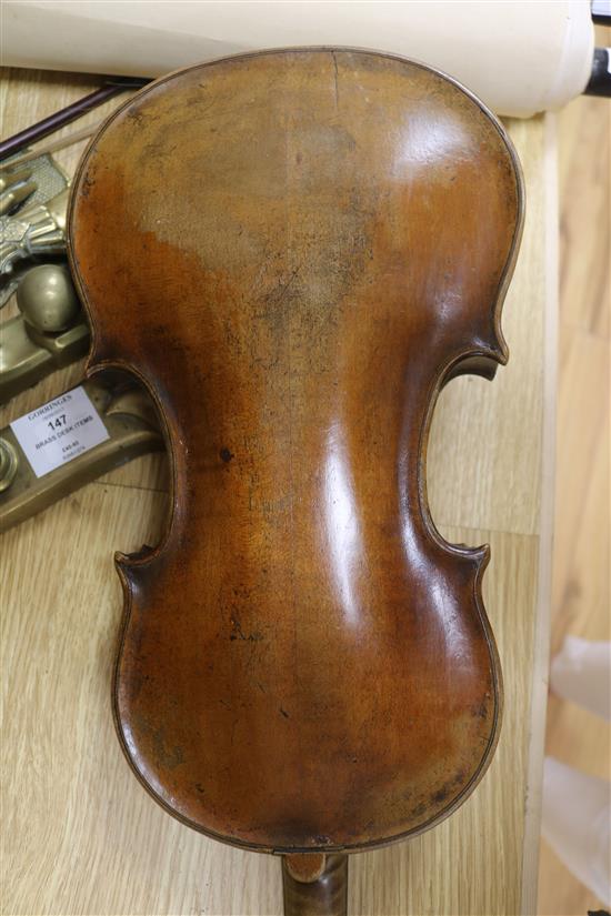 A violin, bow and a mother of pearl inlaid mandolin